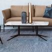 contemporary coffee table with marble laminate top in office setting with the contemporary three-seat sofa